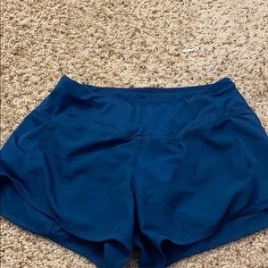 Teal Nike running shorts